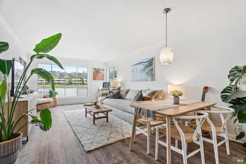 a view of a lake with boats and trees in the background