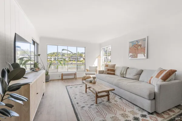 a white bath tub sitting next to a toilet