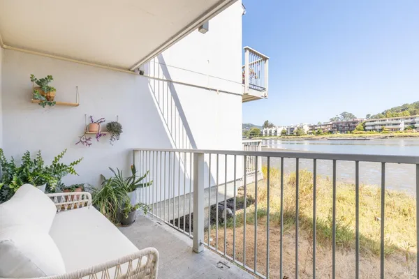 a bathroom with a granite countertop sink a mirror and a shower