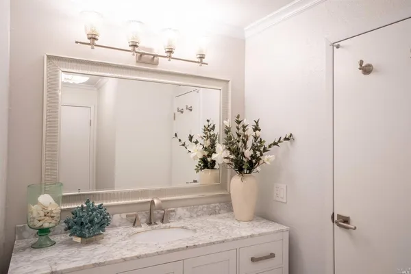 a view of a lake with a house in the background