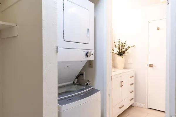 a view of hallway with furniture and a window