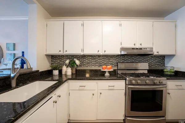 a view of a flower pot on a table near a window