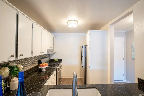 a bedroom with a bed and a chair