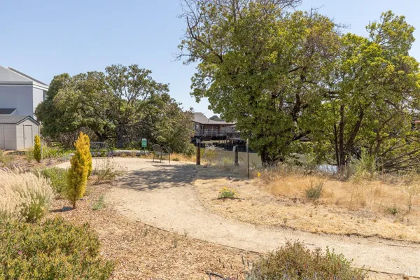 a view of swimming pool with outdoor seating and city view
