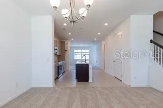a view of kitchen with sink microwave and stove