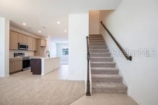 a view of staircase with white walls