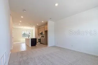 a kitchen with a sink and white cabinets