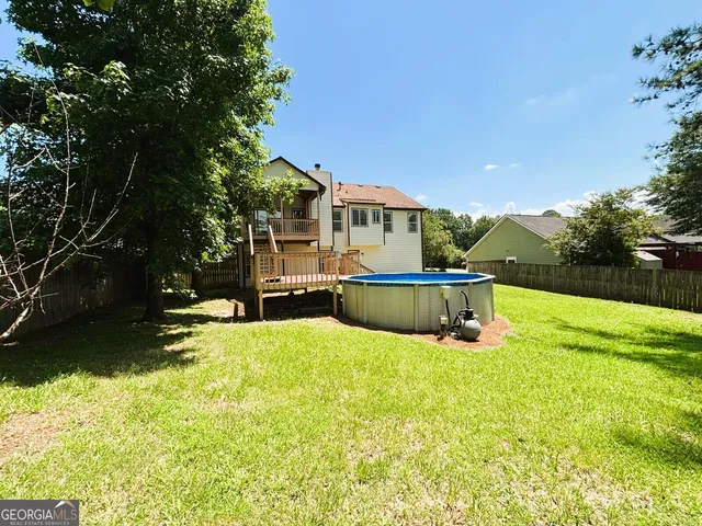 a view of a swimming pool with a patio