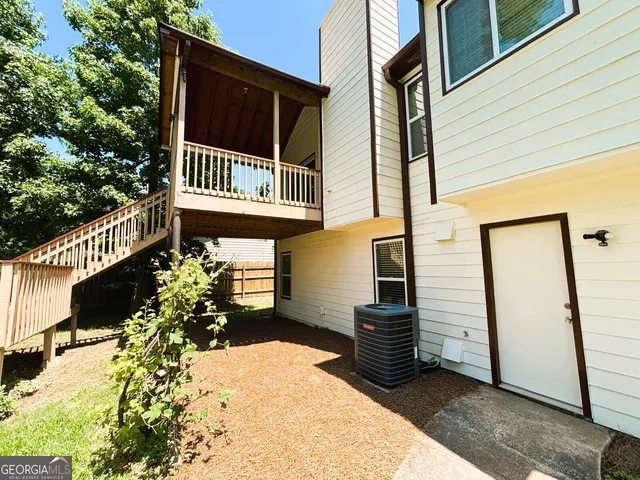 a view of a backyard with sitting area