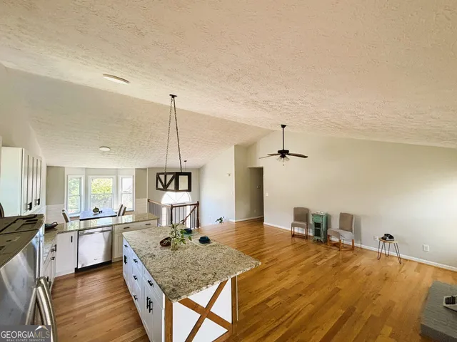 a view of a living room and dining room
