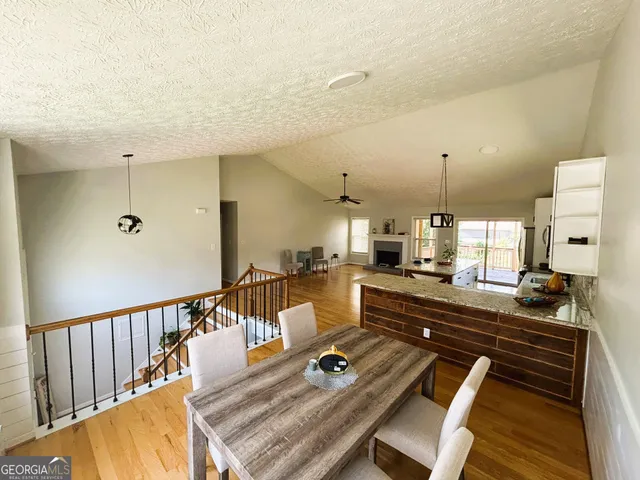 a bathroom with a toilet and a shower curtain