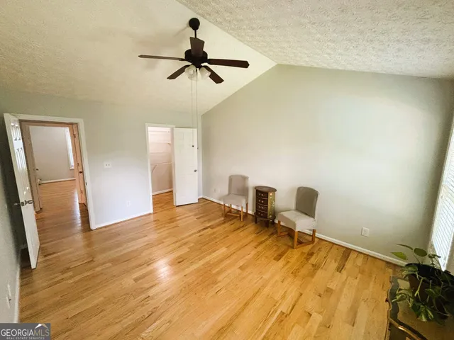 a view of a livingroom with wooden floor and closet