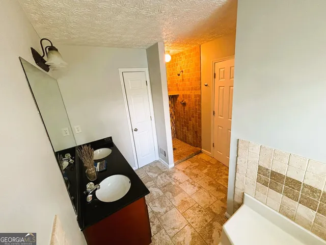 a view of a room with storage and racks on the wall