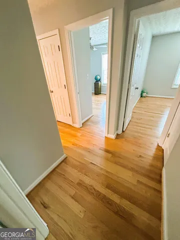 a view of an empty room with windows