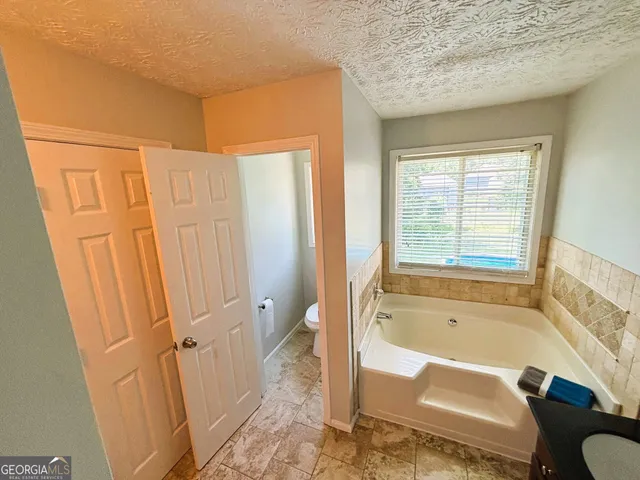 a view of deck with wooden floor and outdoor seating