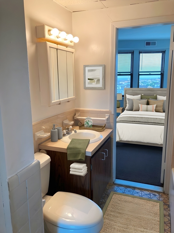 475 Commonwealth Avenue, Unit 605 Boston, MA 02215 - Photo 5 of 12 a bathroom with a sink and a toilet