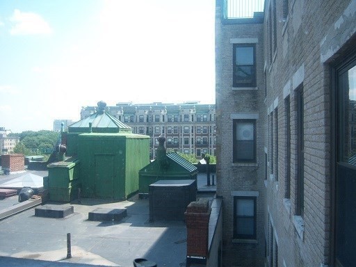 475 Commonwealth Avenue, Unit 605 Boston, MA 02215 - Photo 6 of 12 a view of a house with a backyard and entertaining space