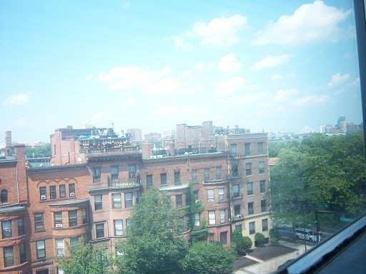 475 Commonwealth Avenue, Unit 605 Boston, MA 02215 - Photo 7 of 12 a view of a city that has tall buildings