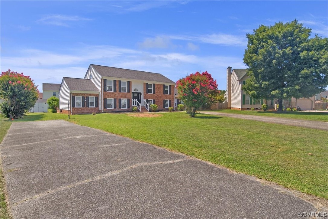 7209 Tree Ridge Place Henrico, VA 23231 - Photo 49 of 49 a front view of a house with a yard and trees