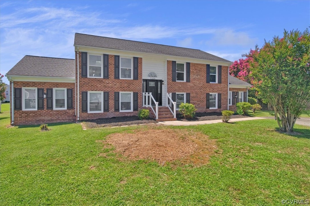 7209 Tree Ridge Place Henrico, VA 23231 - Photo 5 of 49 a front view of a house with garden