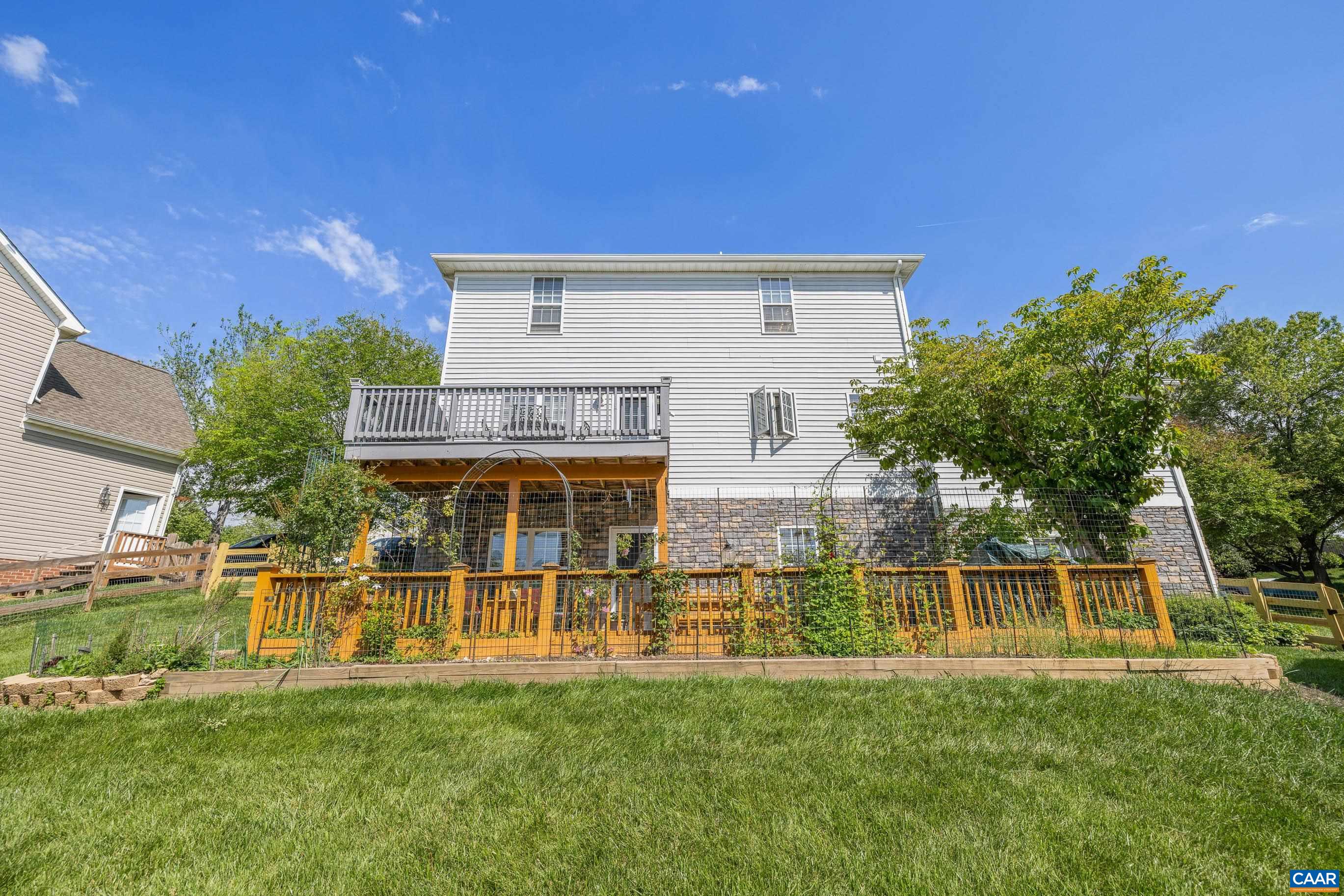 1236 Amber Ridge Road Charlottesville, VA 22901 - Photo 54 of 56 a view of a house with a yard