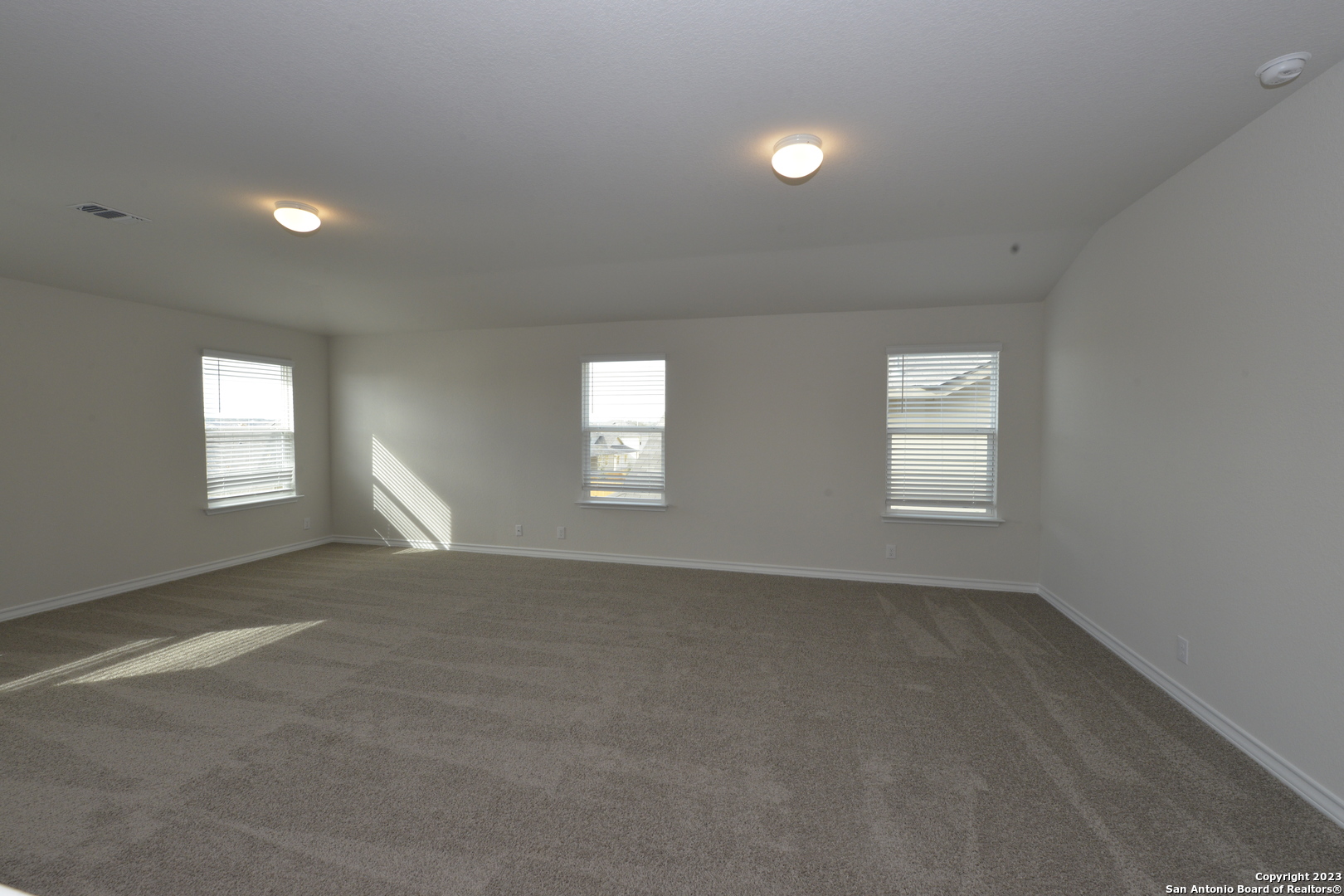 14050 Mudstone Street San Antonio, TX 78253 - Photo 12 of 30 an empty room with windows