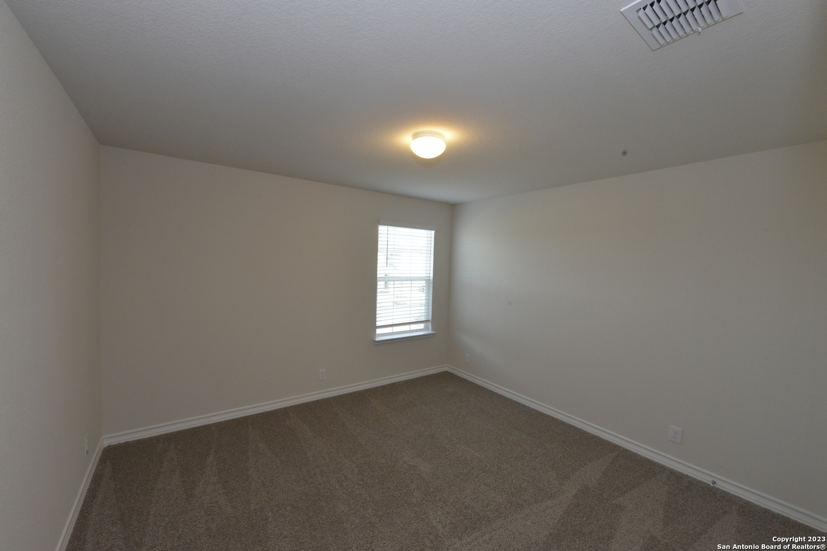 14050 Mudstone Street San Antonio, TX 78253 - Photo 16 of 30 an empty room that has a window