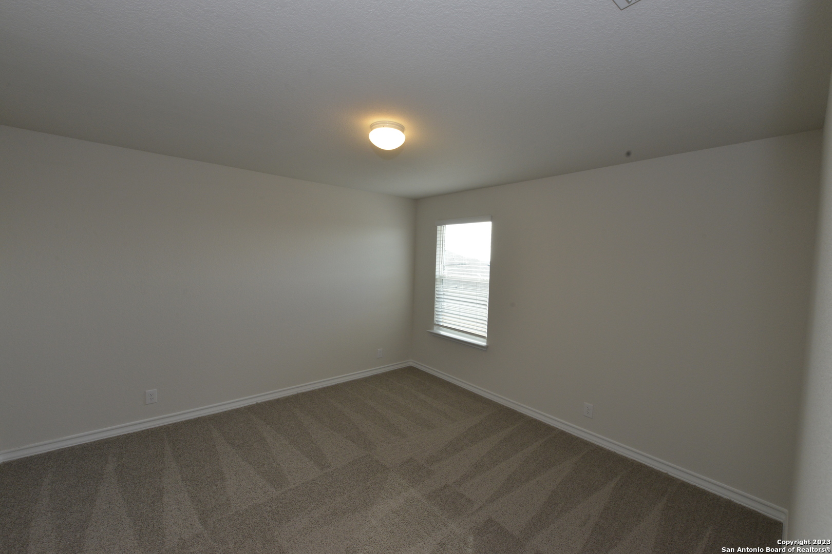 14050 Mudstone Street San Antonio, TX 78253 - Photo 17 of 30 an empty room with windows