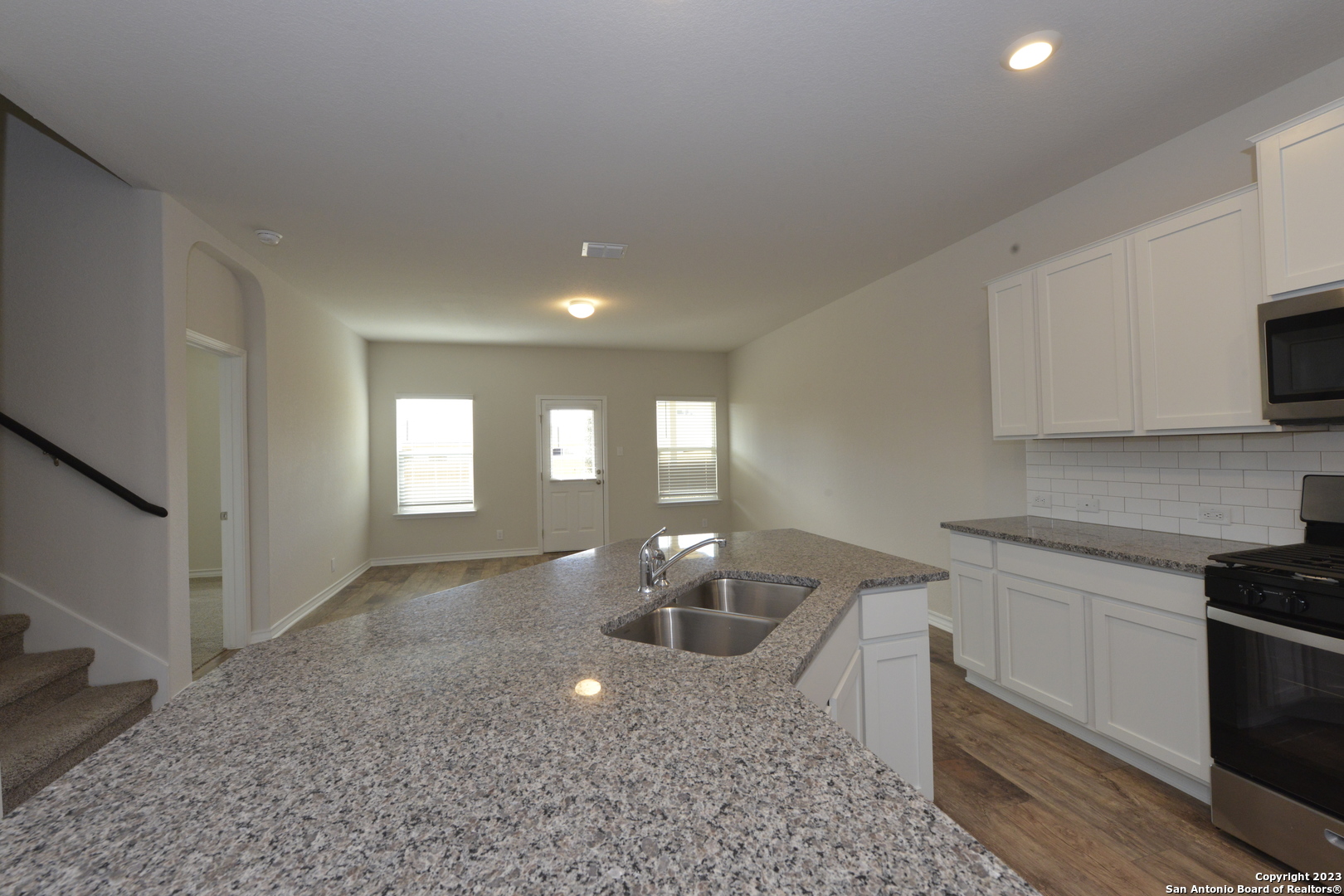 14050 Mudstone Street San Antonio, TX 78253 - Photo 4 of 30 a kitchen with a sink cabinets and window