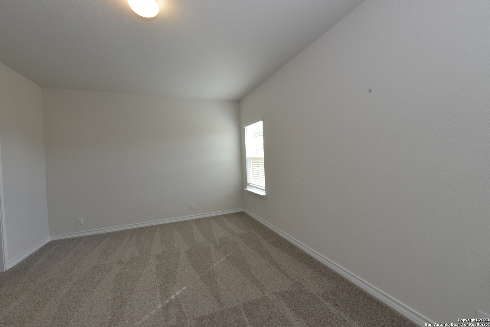 14050 Mudstone Street San Antonio, TX 78253 - Photo 8 of 30 a view of an empty room and window
