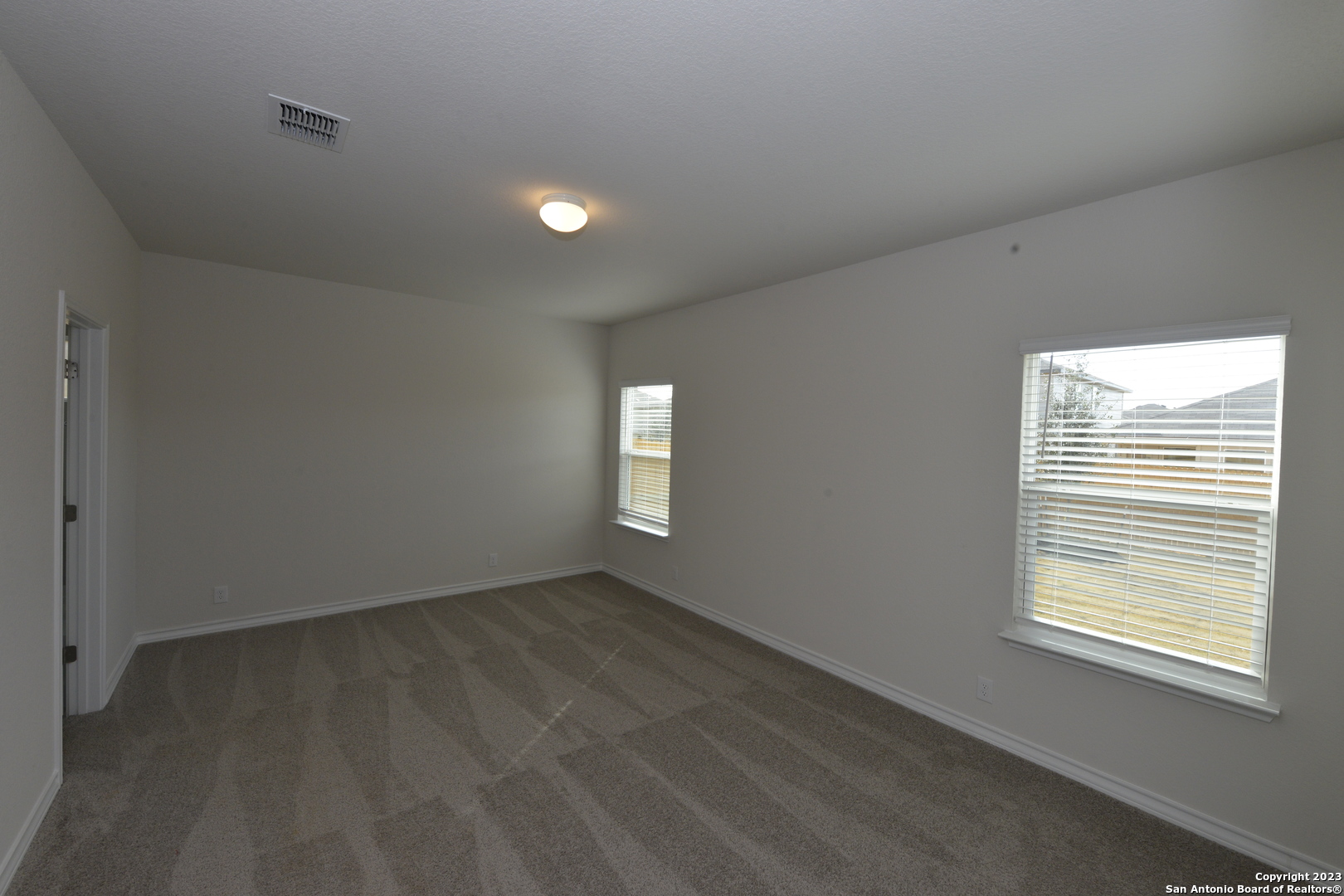 14050 Mudstone Street San Antonio, TX 78253 - Photo 10 of 30 an empty room with a window