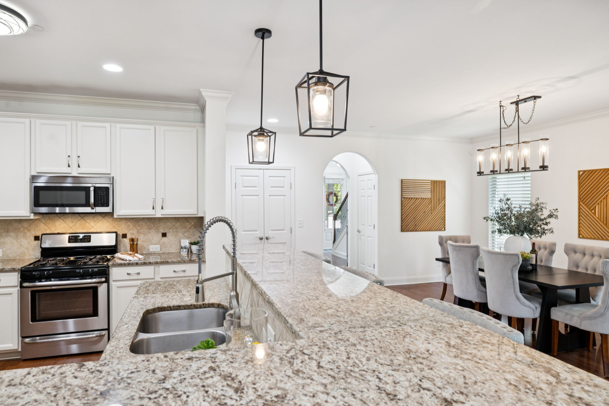 1009 Swanson Lane Franklin, TN 37064 - Photo 28 of 84 a kitchen with stainless steel appliances granite countertop a sink stove and refrigerator