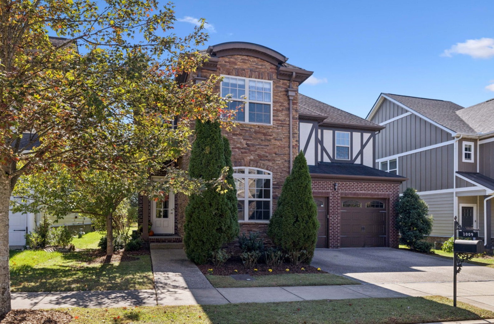 1009 Swanson Lane Franklin, TN 37064 - Photo 3 of 84 a front view of a house with garden