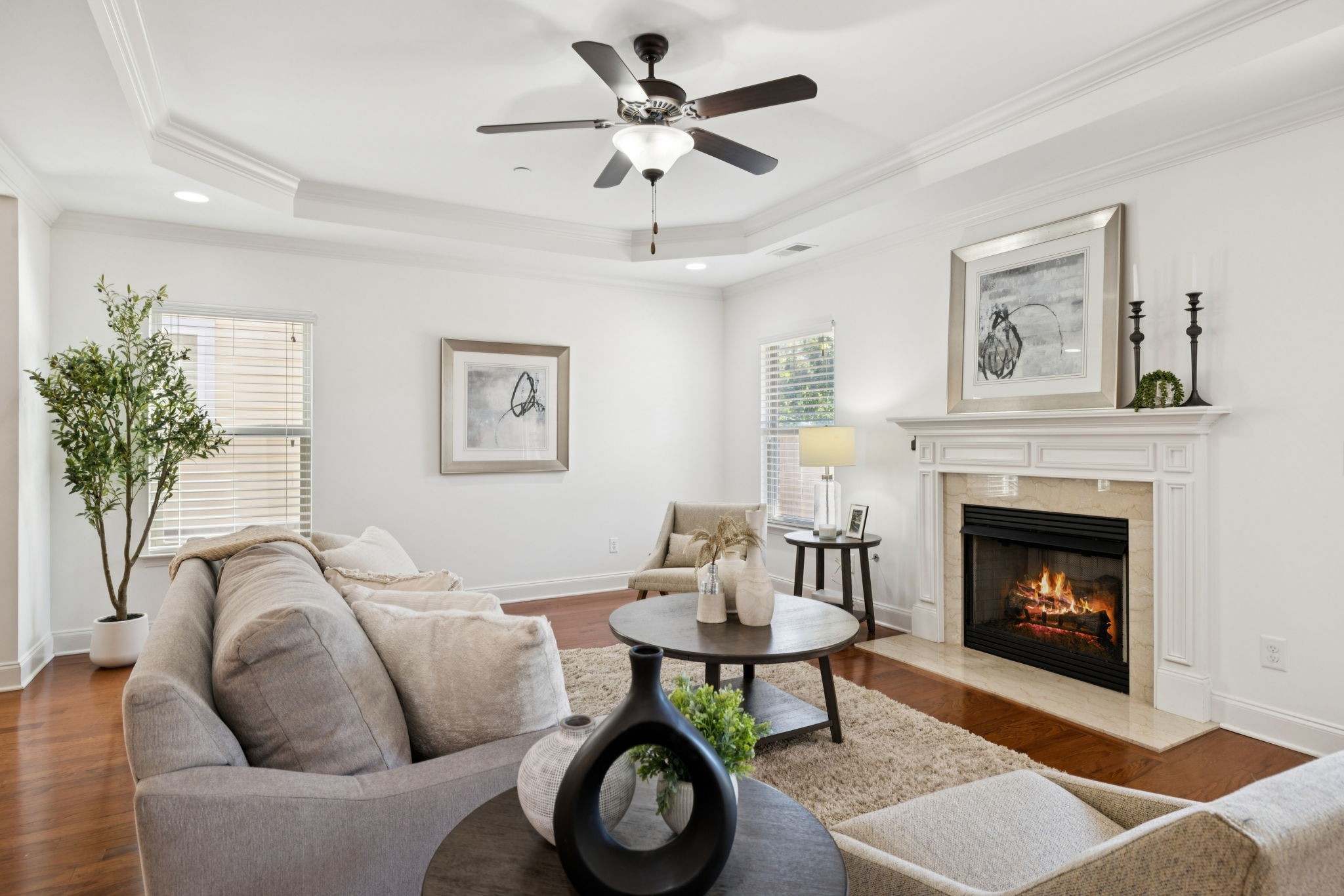 1009 Swanson Lane Franklin, TN 37064 - Photo 32 of 84 a living room with furniture a clock and a fireplace