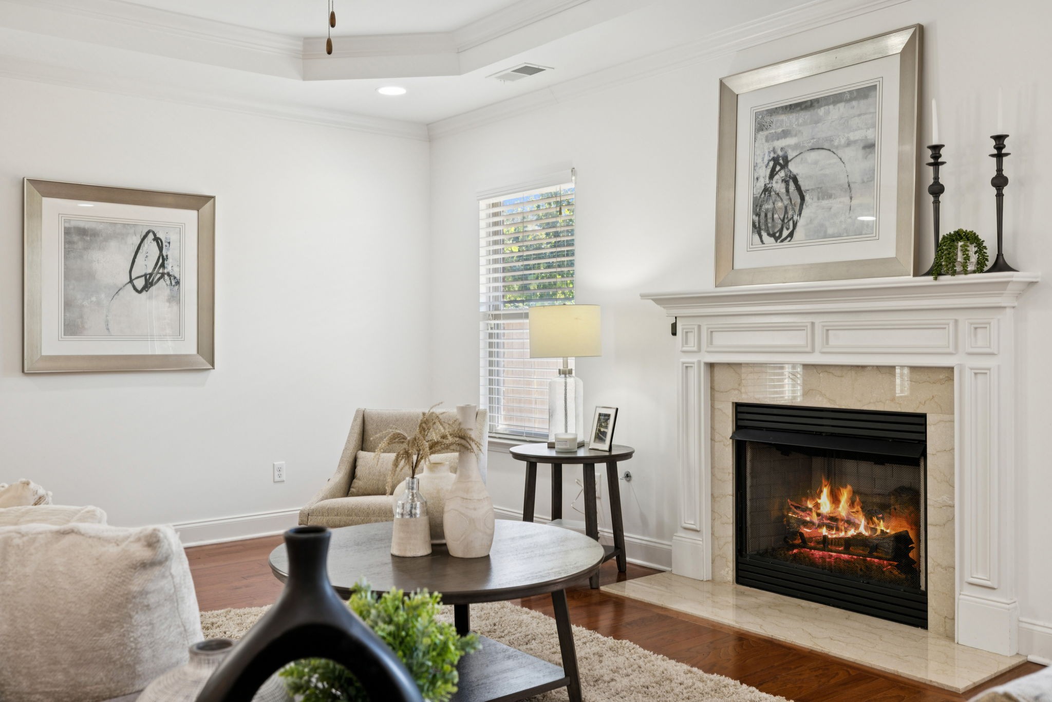 1009 Swanson Lane Franklin, TN 37064 - Photo 33 of 84 a living room with furniture a table and a fireplace