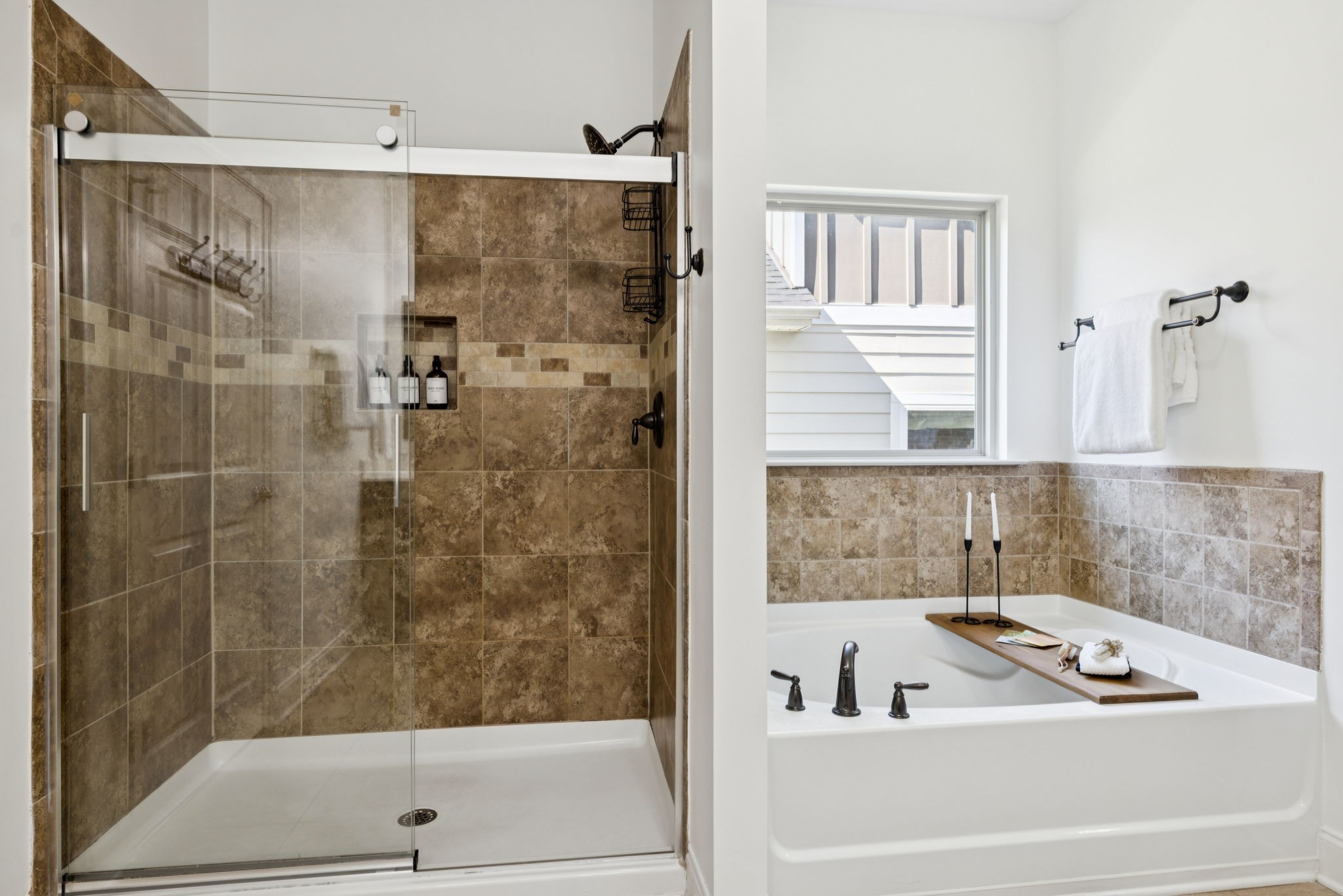 1009 Swanson Lane Franklin, TN 37064 - Photo 49 of 84 a bathroom with a bathtub and a shower