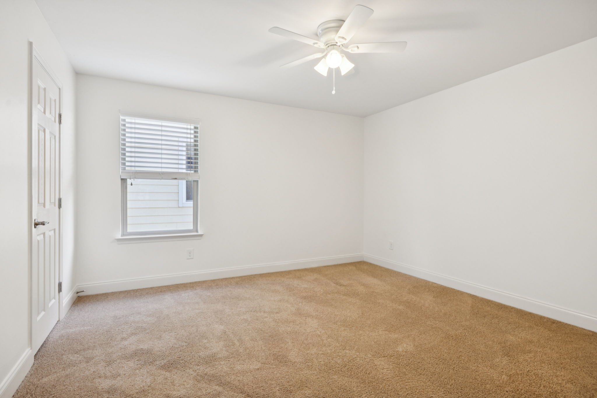1009 Swanson Lane Franklin, TN 37064 - Photo 56 of 84 an empty room with a window and a ceiling fan