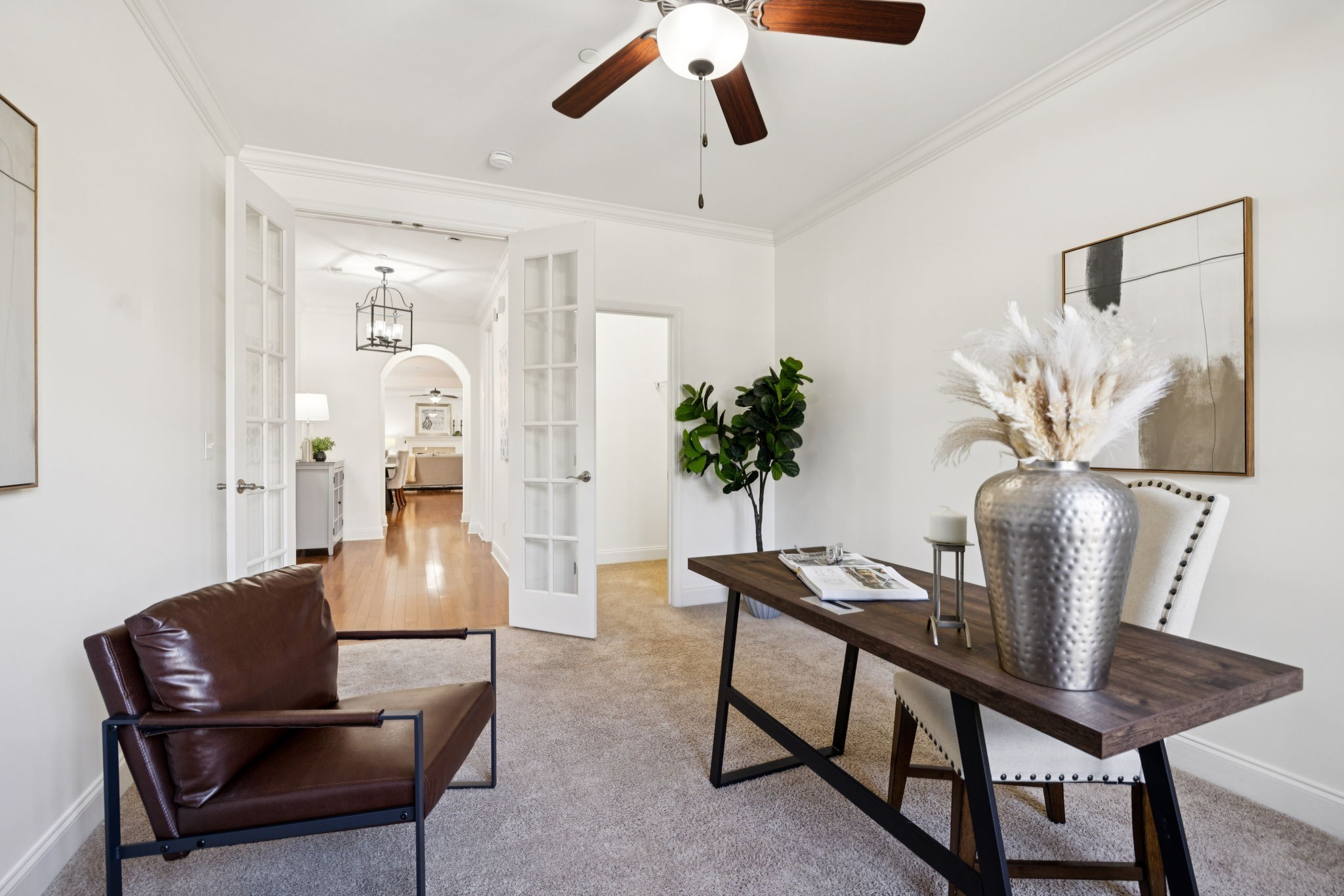 1009 Swanson Lane Franklin, TN 37064 - Photo 7 of 84 a living room with furniture and a potted plant