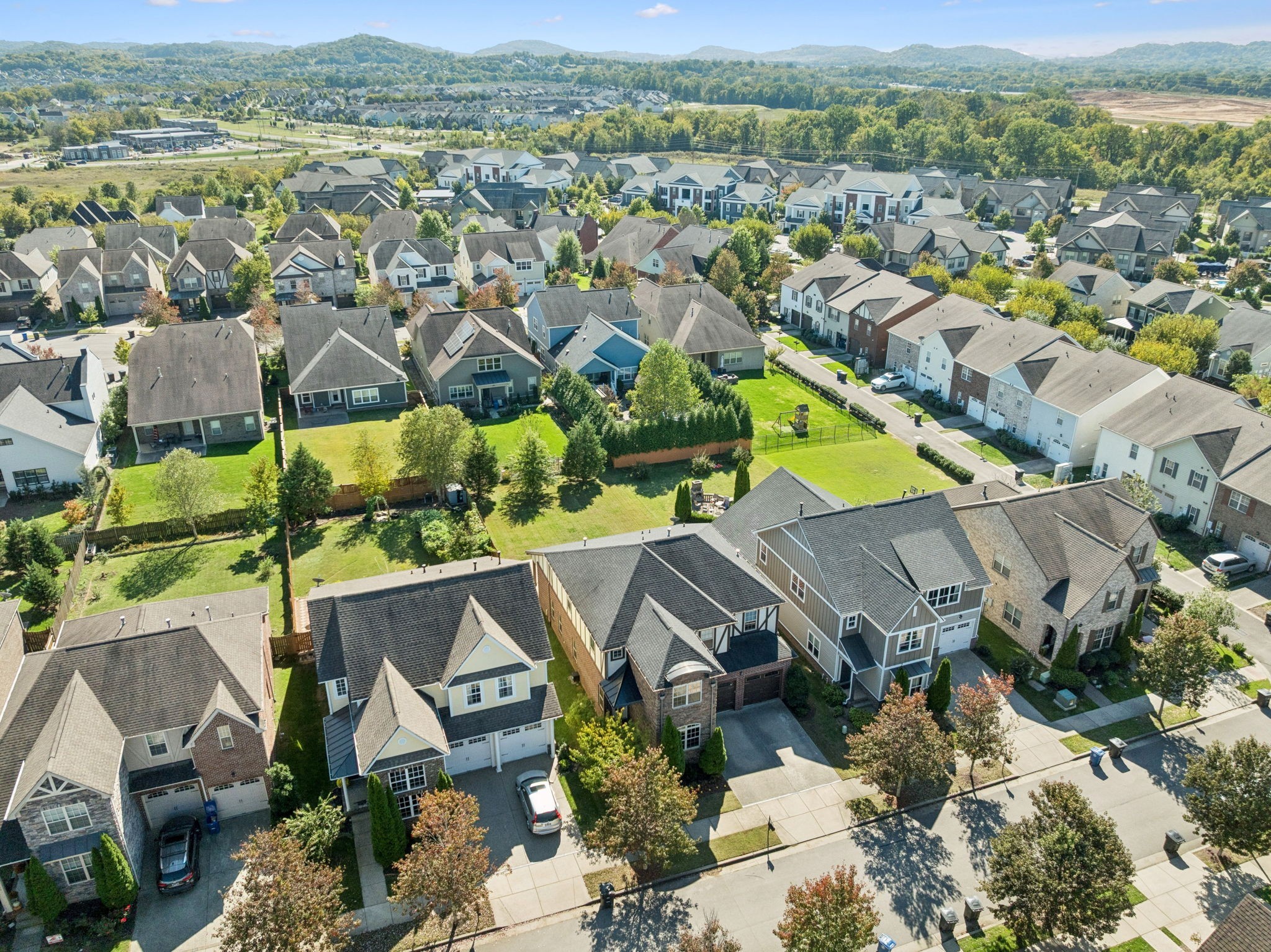 1009 Swanson Lane Franklin, TN 37064 - Photo 71 of 84 an aerial view of residential houses with outdoor space and parking