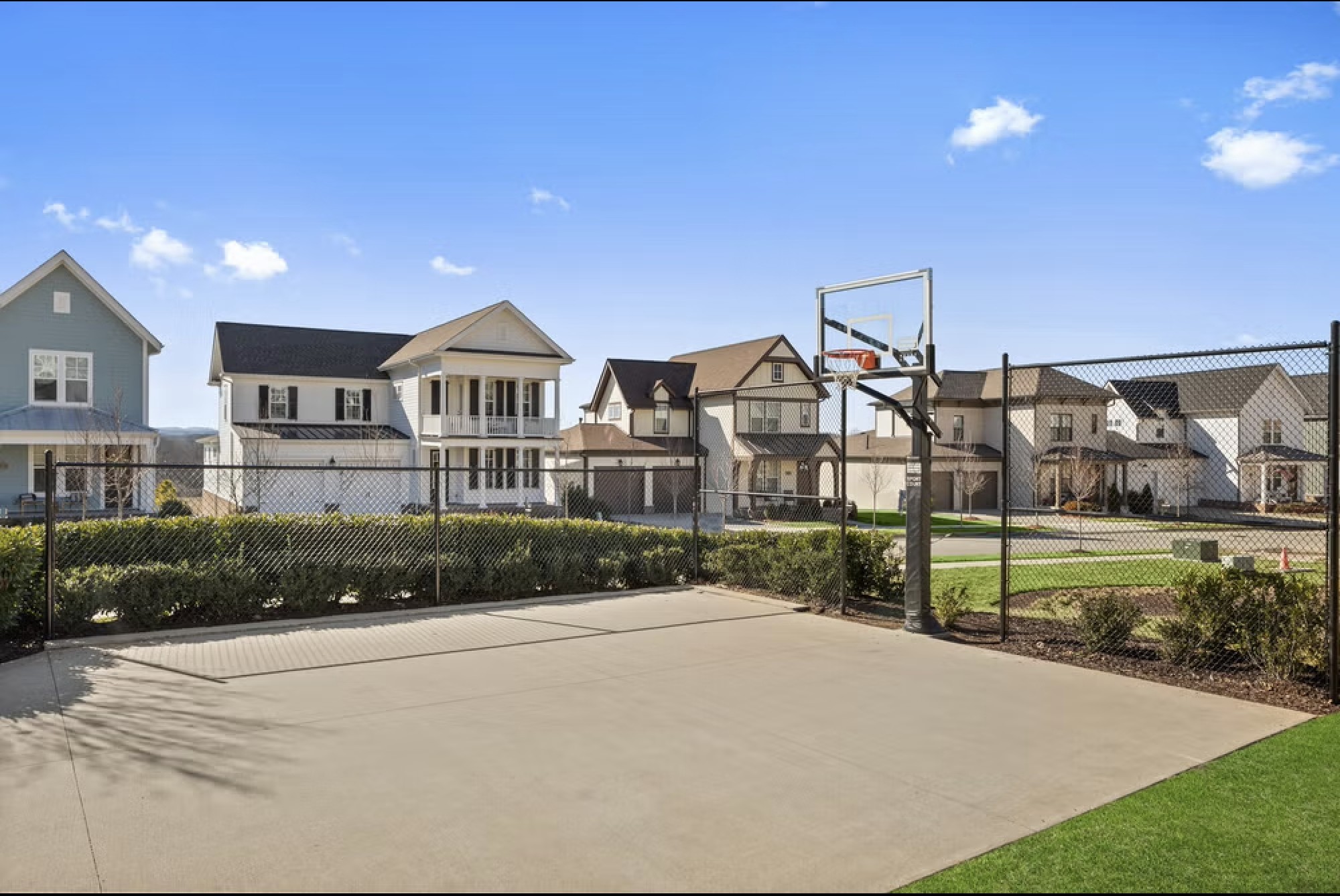 1009 Swanson Lane Franklin, TN 37064 - Photo 81 of 84 a view of a big house next to a yard with large trees