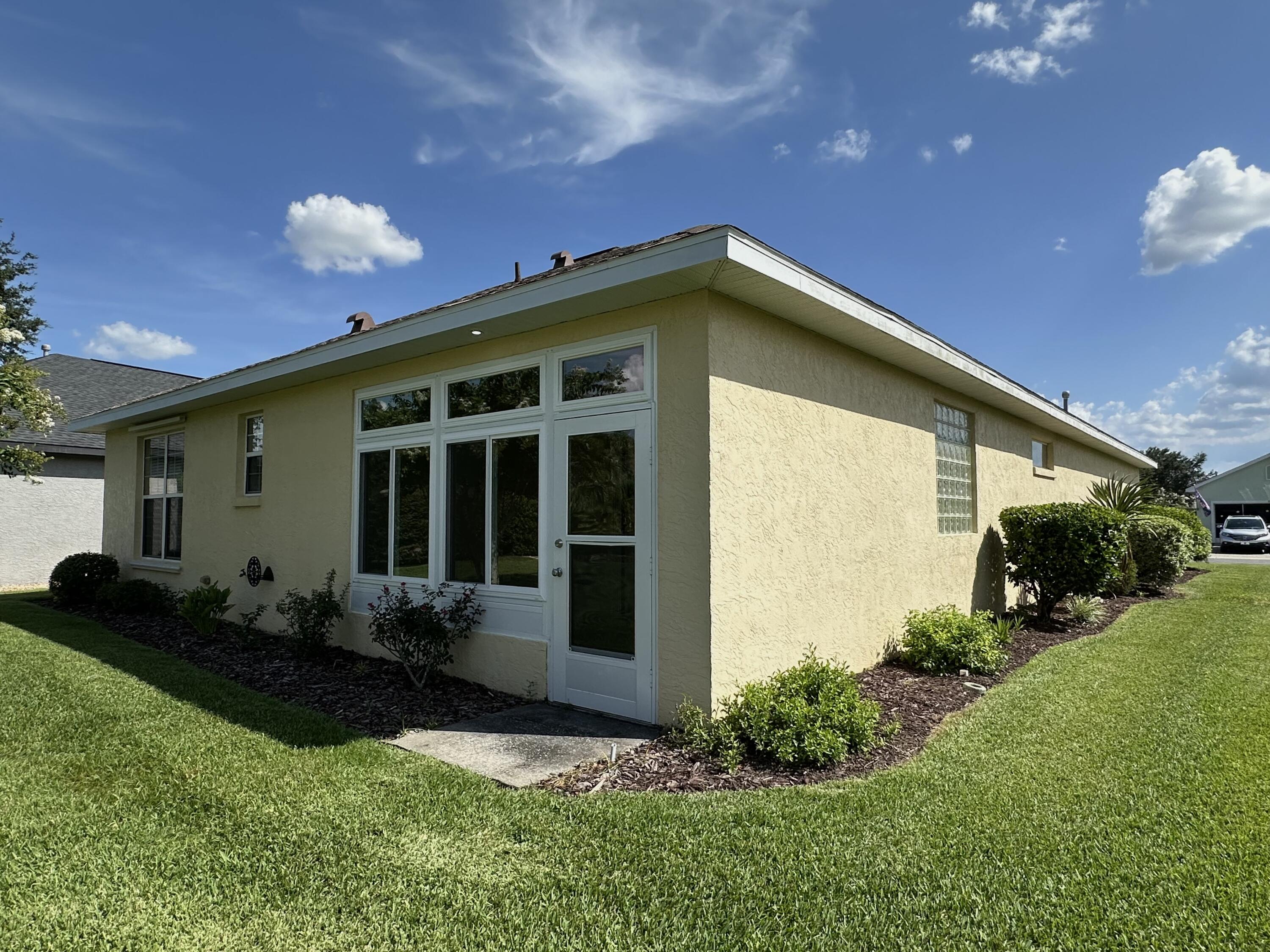 8394 Southwest 82nd Loop Ocala, FL 34481 - Photo 33 of 97 Back view of enclosed lanai