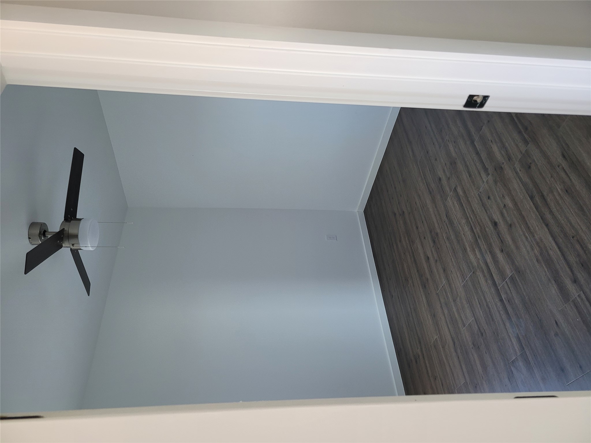 422 A Road Stockdale, TX 78160 - Photo 33 of 40 A quiet room features sleek flooring and a contemporary ceiling fan.