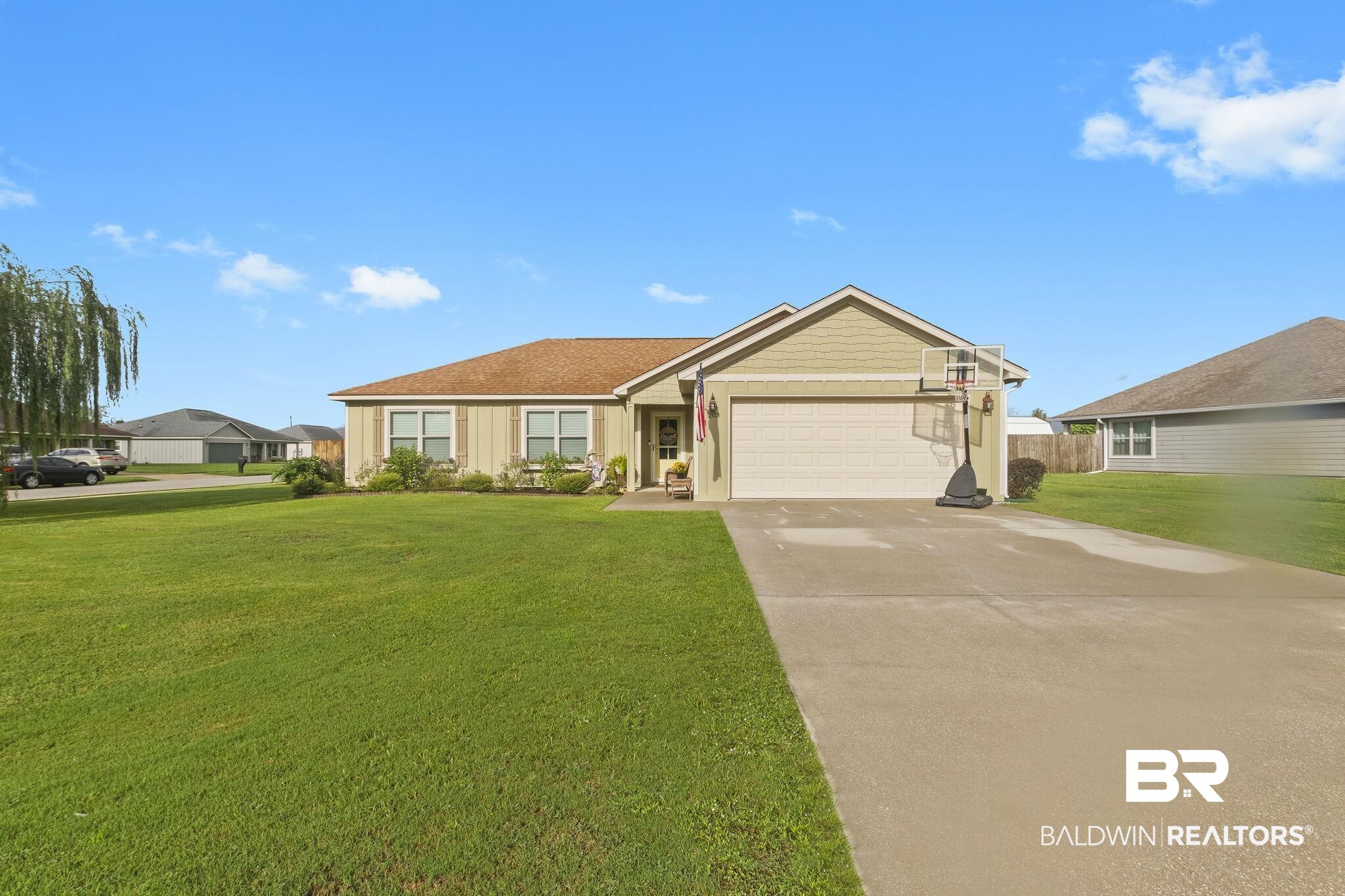 203 Lakefront Circle Summerdale, AL 36580 - Photo 2 of 69 Single story home featuring a front yard and a garage