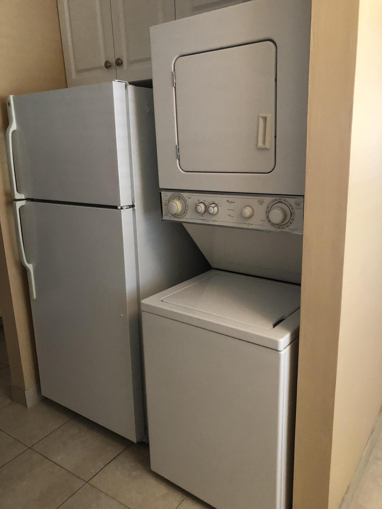 2500 Juniper Drive, Unit 204 Delray Beach, FL 33445 - Photo 3 of 9 a utility room with dryer and washer
