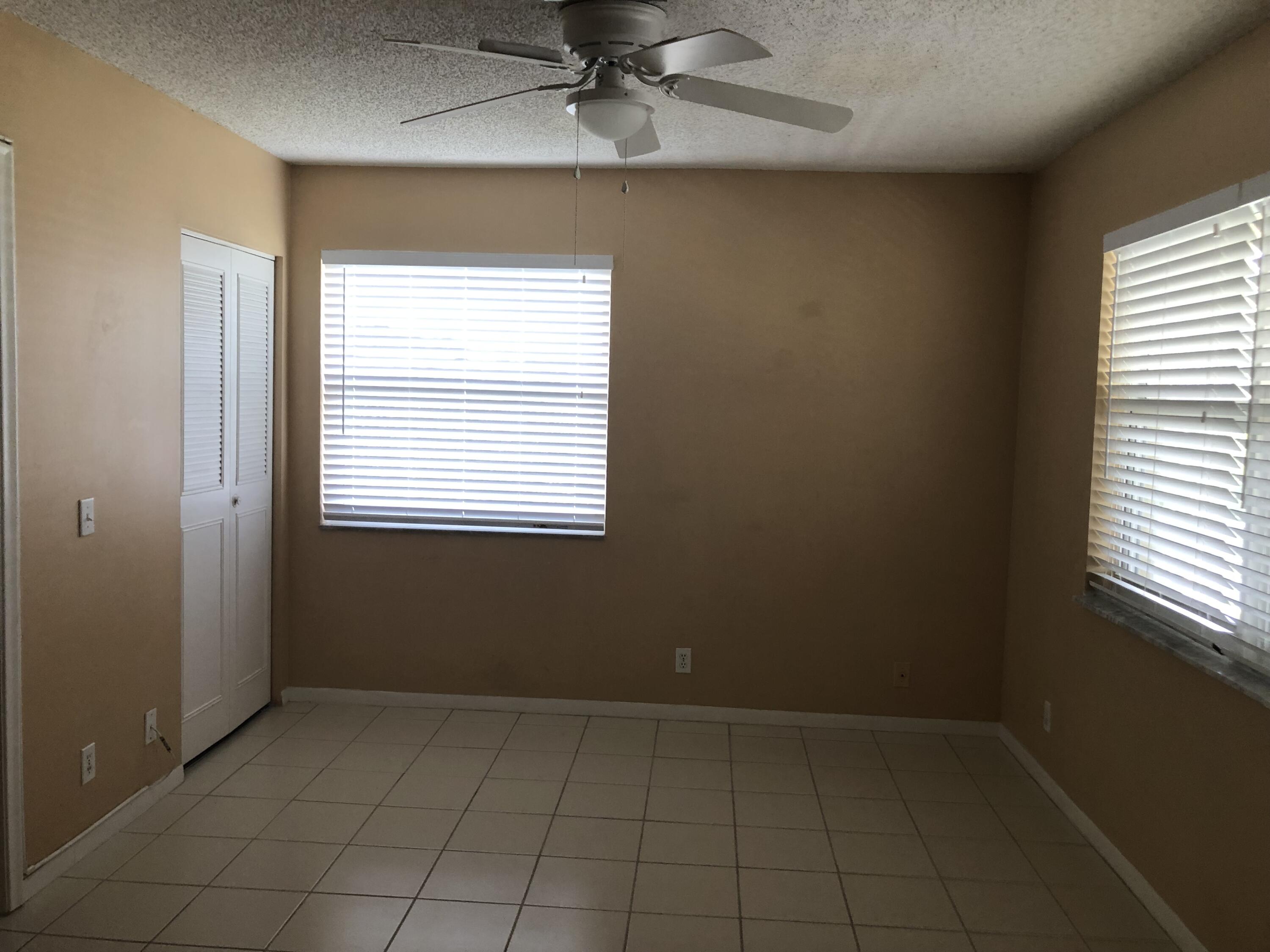 2500 Juniper Drive, Unit 204 Delray Beach, FL 33445 - Photo 4 of 9 an empty room with a window