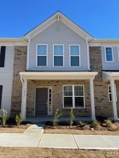 1852 Teachers House Road Northwest Concord, NC 28027 - Photo 1 of 1 a front view of a house with a yard