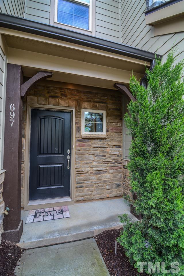 697 Wickham Ridge Road Apex, NC 27539 - Photo 2 of 25 a view of front door and potted plants