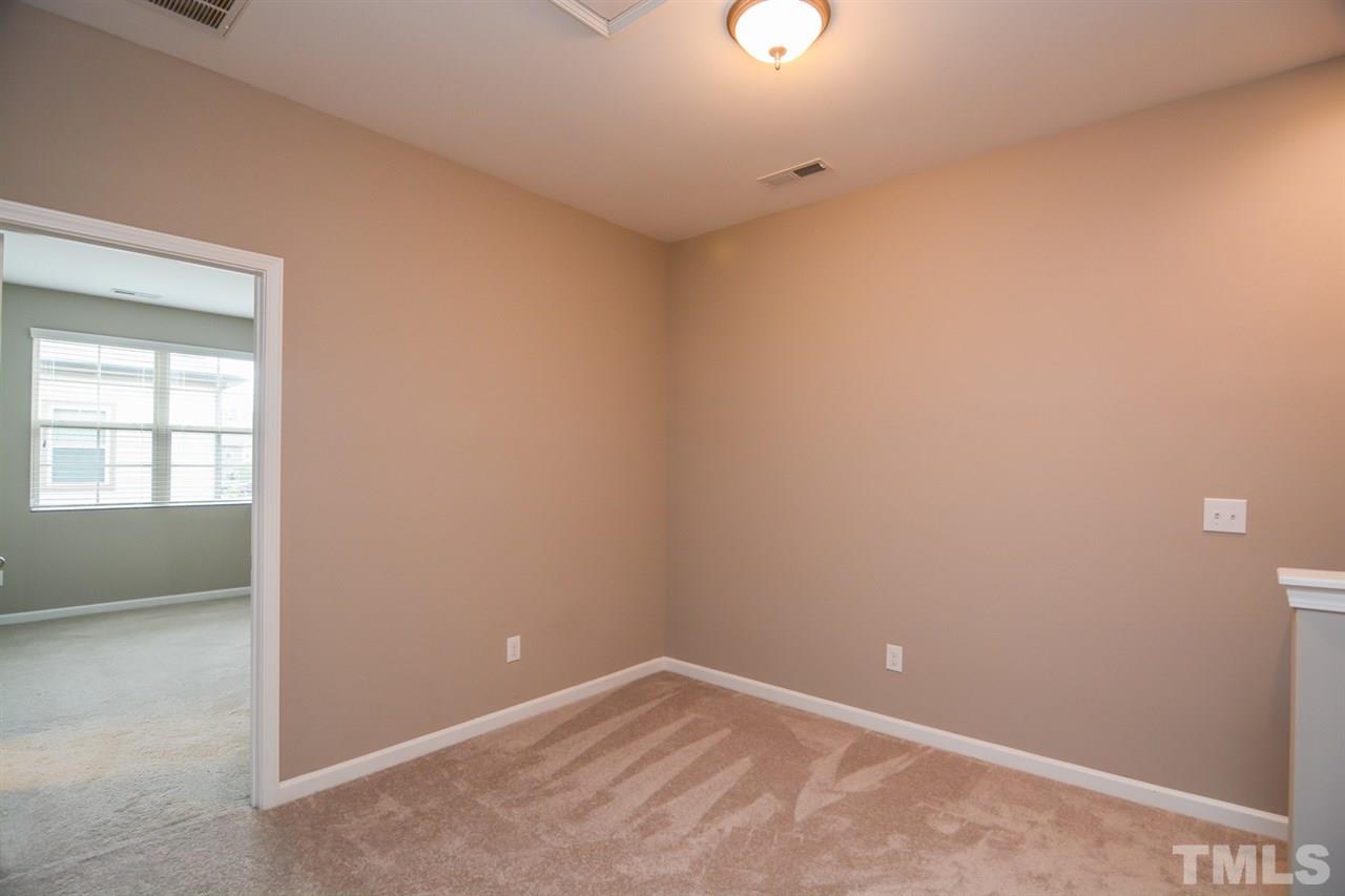 697 Wickham Ridge Road Apex, NC 27539 - Photo 12 of 25 an empty room with a window