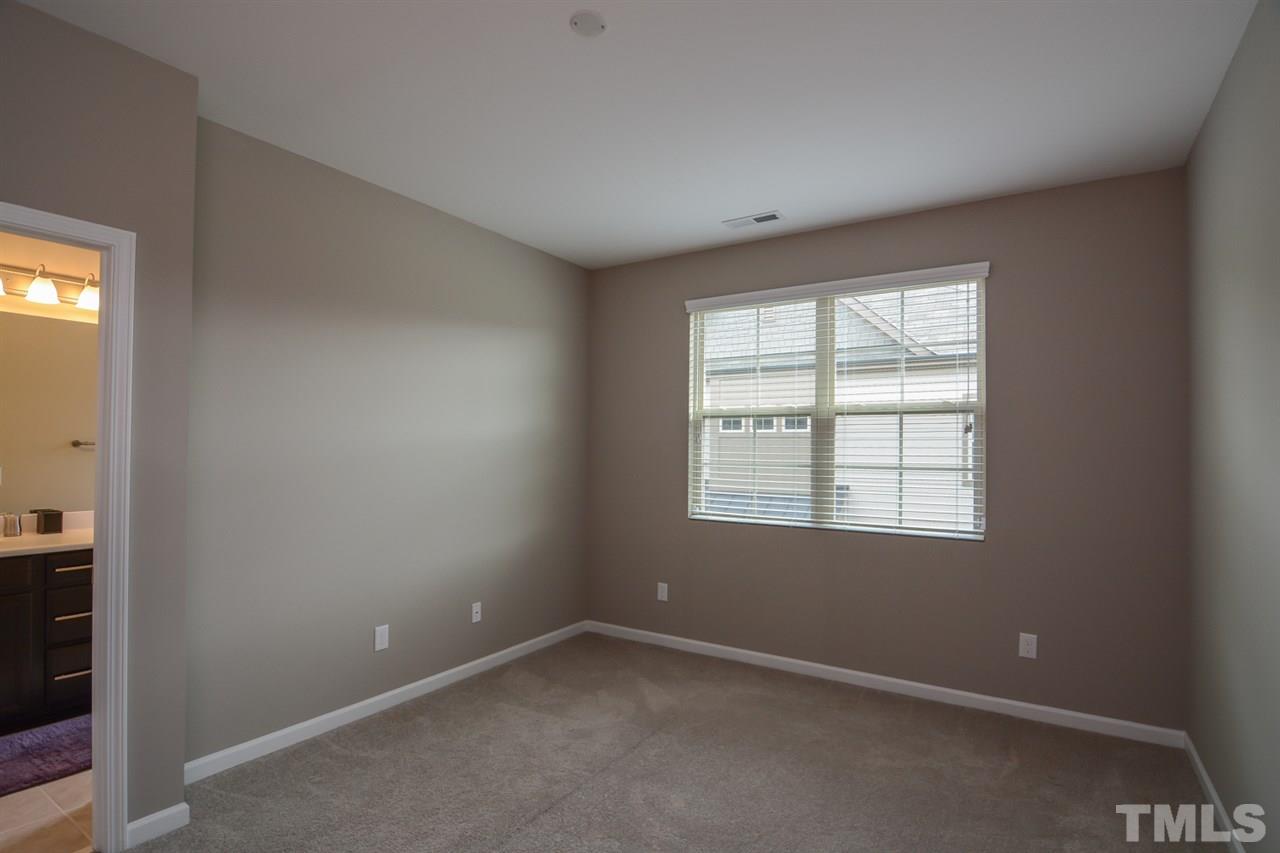697 Wickham Ridge Road Apex, NC 27539 - Photo 13 of 25 an empty room with a window