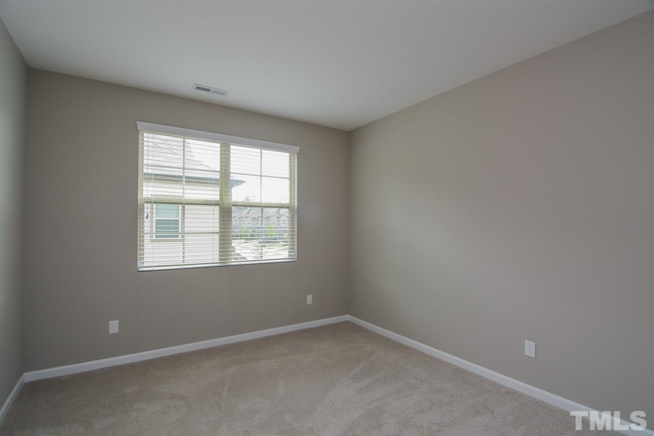 697 Wickham Ridge Road Apex, NC 27539 - Photo 14 of 25 an empty room with a window